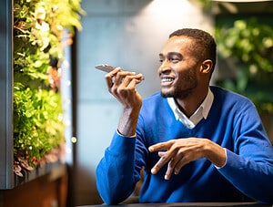 Black young man talking into cell phone